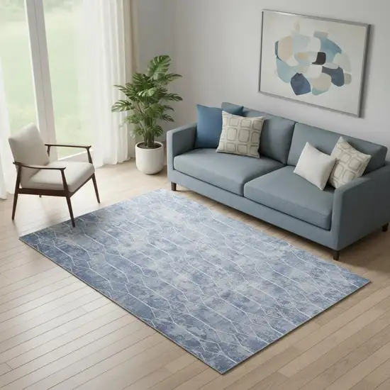 5' X 7' Blue and Off White Geometric Power Loom Washable Area Rug Photo 1