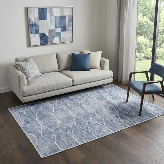 5' X 7' Blue and Off White Geometric Power Loom Washable Area Rug Photo 1