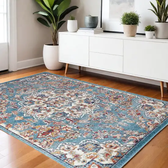 Ivory Blue and Orange Medallion Power Loom Area Rug Photo 1