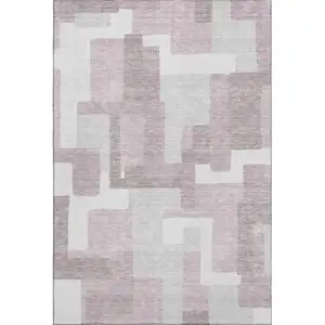 Photo of Blush And Ivory Abstract Geometric Washable Area Rug With UV Protection