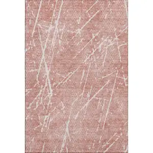 Photo of Blush And Ivory Abstract Washable Area Rug With UV Protection