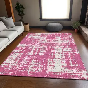 Photo of Blush And Ivory Abstract Washable Area Rug With UV Protection