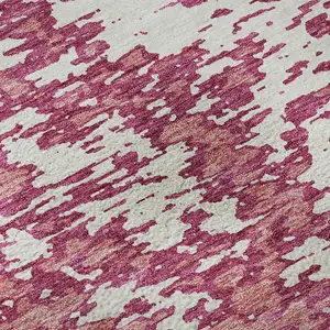 Photo of Blush And Ivory Abstract Washable Area Rug With UV Protection