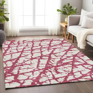 Photo of Blush And Ivory Abstract Washable Area Rug With UV Protection