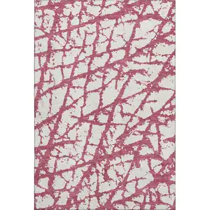 Photo of Blush And Ivory Abstract Washable Area Rug With UV Protection