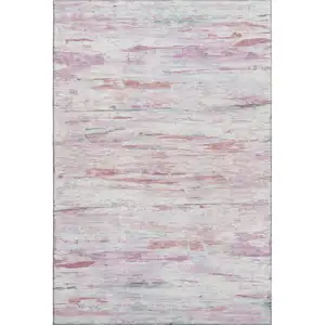 Photo of Blush And Ivory Abstract Washable Area Rug With UV Protection