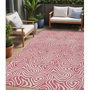 Photo of Blush And Ivory Abstract Washable Indoor Outdoor Area Rug