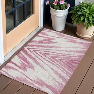 Photo of Blush And Ivory Abstract Washable Indoor Outdoor Area Rug