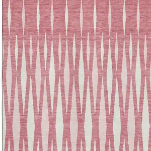 Photo of Blush And Ivory Geometric Washable Area Rug With UV Protection