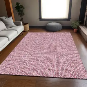Photo of Blush And Ivory Geometric Washable Area Rug With UV Protection