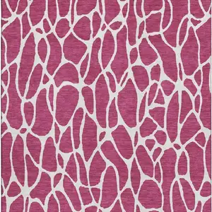 Photo of Blush And Ivory Geometric Washable Area Rug With UV Protection