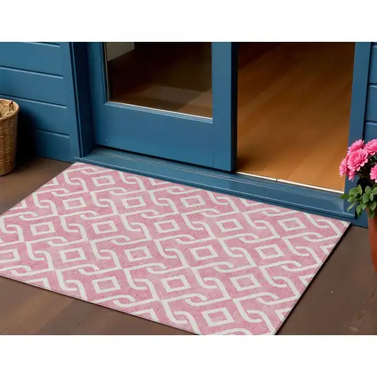 Blush And Ivory Geometric Washable Indoor Outdoor Area Rug Photo 1