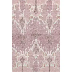 Photo of Blush And Ivory Ikat Washable Area Rug With UV Protection
