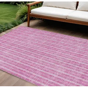 Photo of Blush And Ivory Striped Washable Indoor Outdoor Area Rug