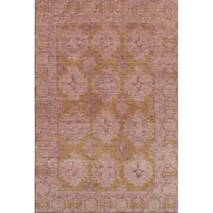 Photo of Blush And Orange Oriental Washable Area Rug With UV Protection