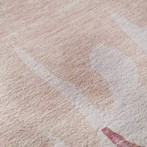 Photo of Blush And Pink Abstract Washable Area Rug With UV Protection