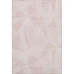 Photo of Blush And Pink Geometric Washable Area Rug With UV Protection