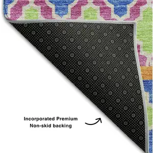 Photo of Blush Blue And Orange Ikat Washable Area Rug With UV Protection