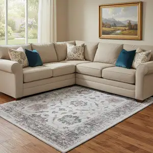 Photo of Blush Ivory And Denim Blue Oriental Washable Area Rug With UV Protection