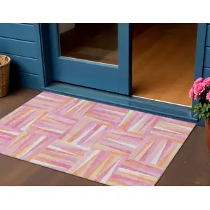 Photo of Blush Ivory And Orange Geometric Washable Indoor Outdoor Area Rug