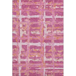 Photo of Blush Ivory And Orange Striped Washable Area Rug With UV Protection