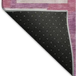 Photo of Blush Mauve And Ivory Abstract Geometric Washable Area Rug With UV Protection