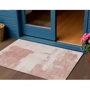 Photo of Blush Mauve And Ivory Abstract Washable Indoor Outdoor Area Rug