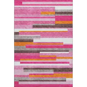 Photo of Blush Orange And Gray Striped Washable Area Rug With UV Protection