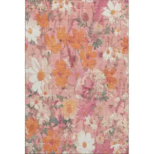 Photo of Blush Orange And Ivory Floral Washable Area Rug With UV Protection