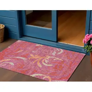 Photo of Blush Orange And Ivory Floral Washable Indoor Outdoor Area Rug