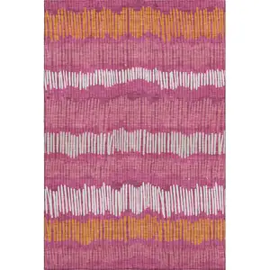 Photo of Blush Orange And Ivory Striped Washable Area Rug With UV Protection