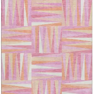 Photo of Blush Peach And Ivory Geometric Washable Area Rug With UV Protection