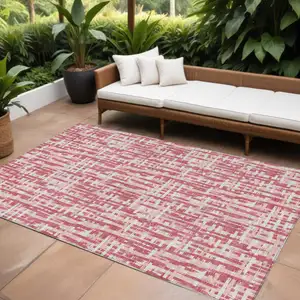 Photo of Blush Pink And Beige Abstract Washable Indoor Outdoor Area Rug