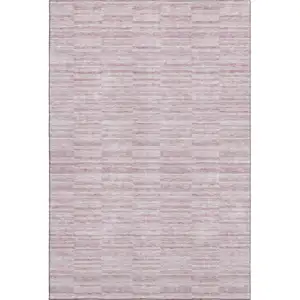Photo of Blush Pink And Beige Striped Washable Area Rug With UV Protection