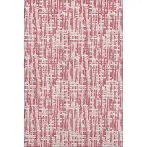 Photo of Blush Pink And Ivory Abstract Geometric Washable Area Rug With UV Protection