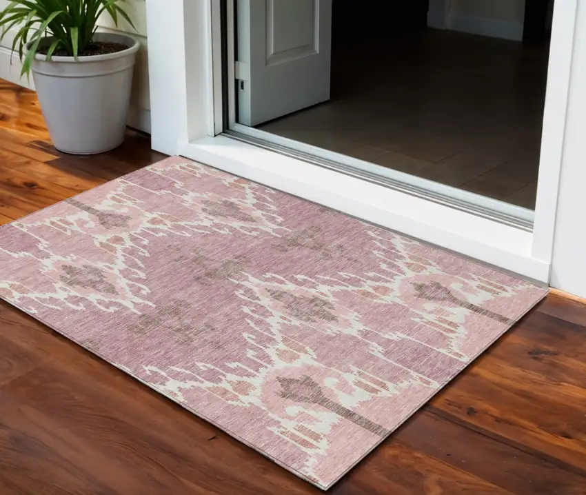 Blush Pink And Ivory Ikat Washable Indoor Outdoor Area Rug Photo 1