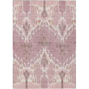 Photo of Blush Pink And Ivory Ikat Washable Indoor Outdoor Area Rug
