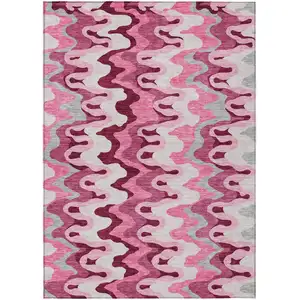 Photo of Blush Pink And Mauve Abstract Washable Indoor Outdoor Area Rug
