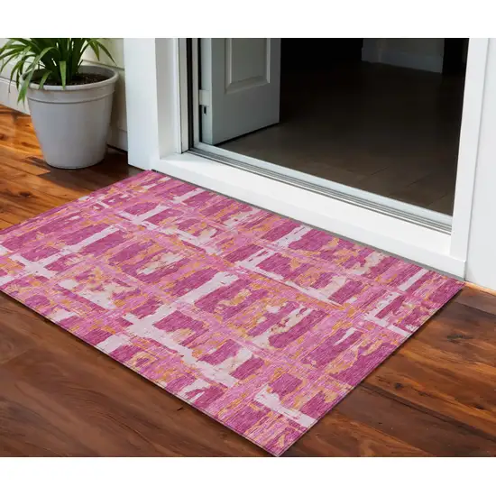 Blush Pink And Orange Striped Washable Indoor Outdoor Area Rug Photo 1