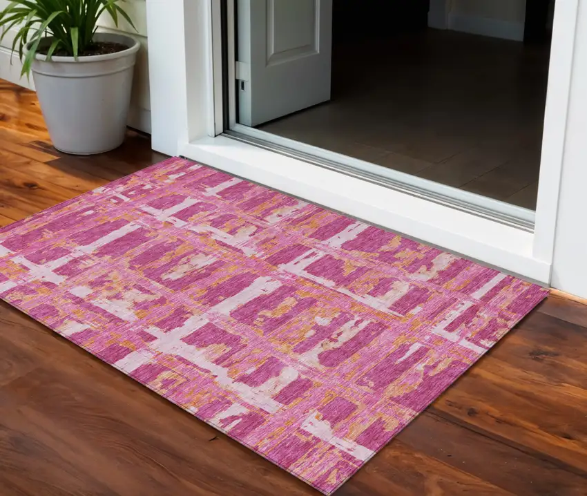 Blush Pink And Orange Striped Washable Indoor Outdoor Area Rug Photo 1