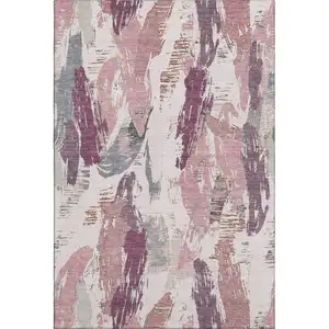 Photo of Blush Purple And Ivory Abstract Washable Area Rug With UV Protection