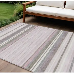 Photo of Blush Purple And Ivory Striped Washable Indoor Outdoor Area Rug