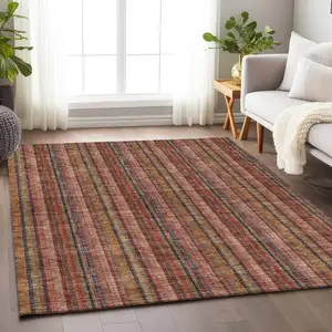 Photo of Blush Purple And Orange Striped Washable Area Rug With UV Protection
