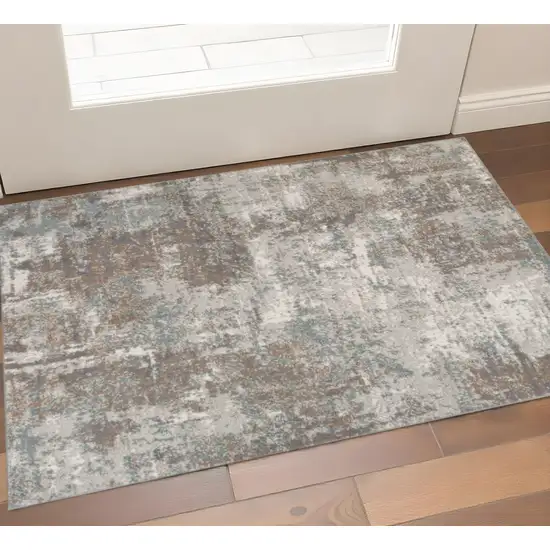 Ivory Brown And Green Abstract Area Rug Photo 1