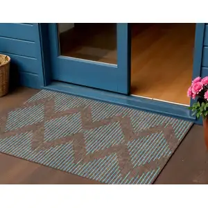Photo of Brown And Aqua Geometric Washable Indoor Outdoor Area Rug