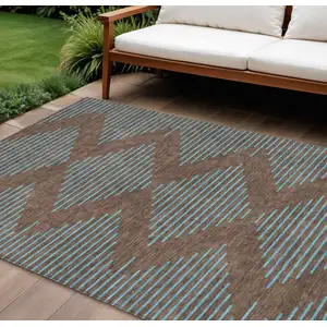 Photo of Brown And Aqua Geometric Washable Indoor Outdoor Area Rug