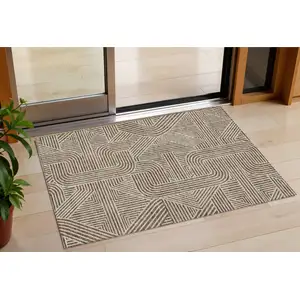 Photo of Brown And Beige Abstract Washable Indoor Outdoor Area Rug