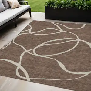 Photo of Brown And Beige Abstract Washable Indoor Outdoor Area Rug