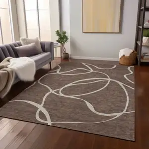 Photo of Brown And Beige Abstract Washable Indoor Outdoor Area Rug