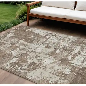 Photo of Brown And Beige Abstract Washable Indoor Outdoor Area Rug